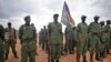 FILE- South Sudanese former rebel soldiers stand to attention at a military camp in the capital Juba, South Sudan, Thursday, April 7, 2016. (AP Photo/Jason Patinkin)