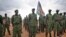 South Sudanese rebel soldiers stand to attention at a military camp in the capital Juba, South Sudan, Thursday, April 7, 2016. (AP Photo/Jason Patinkin)