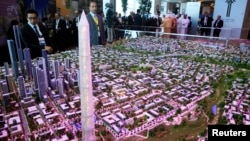 FILE - A model of a planned new capital for Egypt is displayed for investors at the opening of the Egypt Economic Development Conference (EEDC) in Sharm el-Sheikh, in the South Sinai governorate, about 550 km (342 miles) south of Cairo, March 13, 2015. 