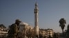 A member of the security forces of the newly formed Syrian government patrols an area near to a security checkpoint in Homs, Syria, Dec. 26, 2024.