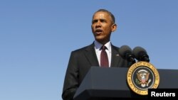 U.S. President Barack Obama delivers remarks on clean energy after a tour of a solar power array at Hill Air Force Base, Utah, April 3, 2015. 