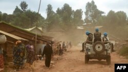 Des soldats de la Monusco patrouillent dans la région de Djugu dans la province de l'Ituri, à l'est de la RDC, le 13 mars 2020.