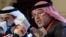 Bahrain's Minister of Justice and Islamic Affairs Shaikh Khalid bin Ali al-Khalifa speaks during a press conference in the capital Manama, Nov. 23, 2018. Amnesty International is "gravely concerned" by Bahrain's suppression of political opposition, a day ahead of the election.