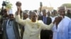 FILE - Burkina Faso Prime Minister Apollinaire Joachim Kyelem de Tambela, center, is pictured at a rally in Niamey, Niger, Dec. 29, 2023. Tambela has been fired, according to a government decree issued Dec. 6, 2024.