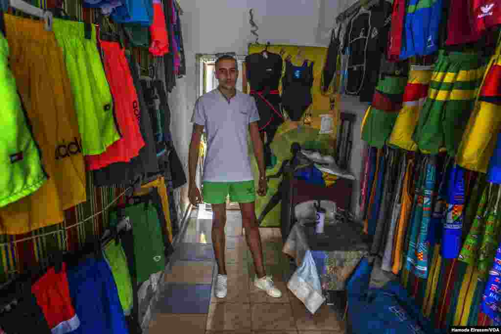 Tharwat Betash, a 21-year-old salesman in Alexandria, Egypt, says &#39;I used to sell triple the amount on display now during a weekend, but now I have been trying to sell this merchandise for the last two weeks. (Hamada Elrasam/VOA) 