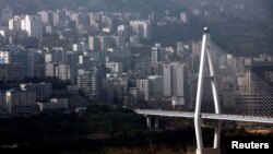 A view of Badong city on the banks of the Yangtze River, in Hubei province, China, August 7, 2012.