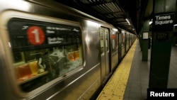 A subway train pulls into the Times Square station.