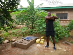 Bodybuilder Samuel Kulbila is living proof that you don’t need expensive equipment to work out. People have been reaching out to him for advice on how to keep fit while gyms are closed. Accra, Ghana, July 5, 2020. (Stacey Knott/VOA)