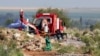 FILE - Rescuers cross the caution tape near a Metalliferous Mobile Rescue Winder during a rescue operation to retrieve illegal miners from an abandoned gold shaft in Stilfontein on Jan. 13, 2025.