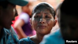 Claudia Maquin, mother of Jakelin Caal, 7, reacts during her daughter's funeral at her home village of San Antonio Secortez, in Guatemala, Dec. 25, 2018. 