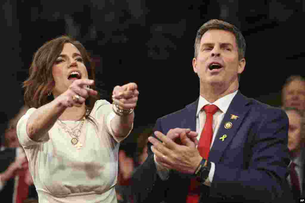 Rep. Nancy Mace, R-S.C., left, and Rep. John McGuire, R-Va., shout as President Donald Trump addresses a joint session of Congress at the Capitol in Washington, March 4, 2025. 