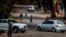 FILE - Few cars and residents are seen in the normally busy streets of Yeoville, downtown Johannesburg, South Africa, April 10, 2020. 