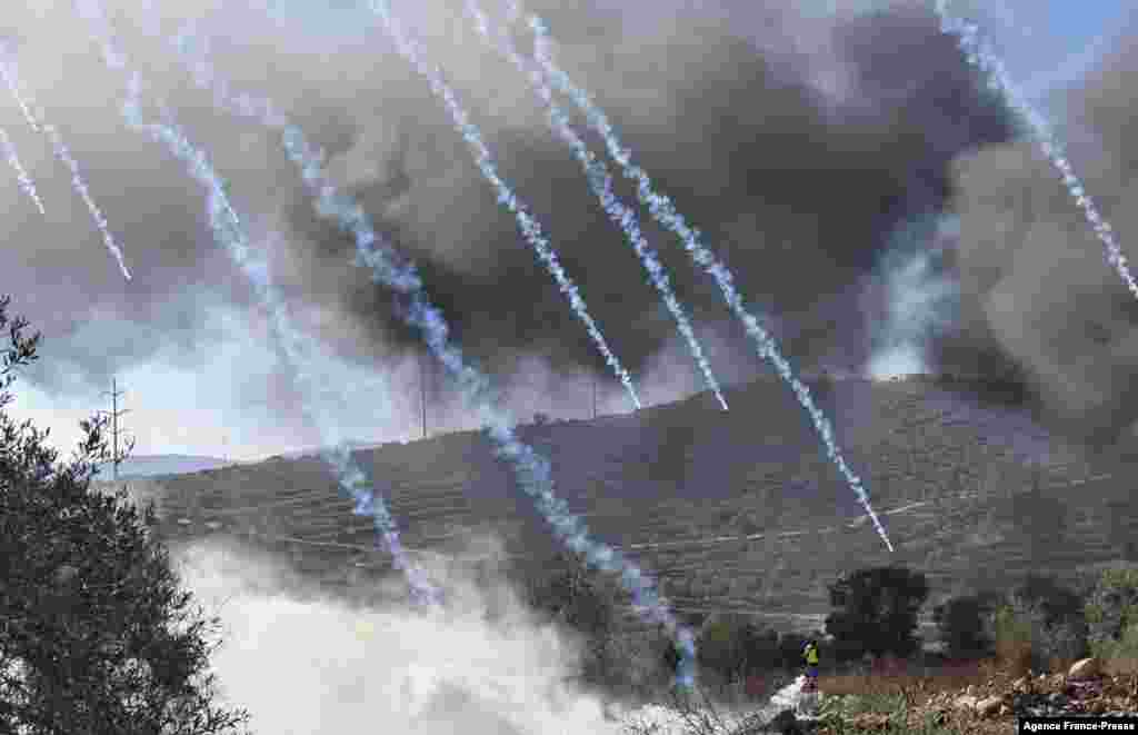 Palestinian protesters and Israeli security forces clash following a demonstration against settlements in the village of Beita in the occupied West Bank.