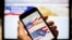 In this photo taken July 15, 2018, the USAReally website is seen on an iPhone screen in Moscow, Russia. The site appears oddly amateurish and obviously Russian, with grammatical flubs and links to Russian social networks.