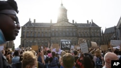 People take part in a Black Lives Matter protest in front of the Royal Palace on Dam Square in Amsterdam, Netherlands, June 1, 2020, to protest against the recent killing of George Floyd.