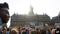 People take part in a Black Lives Matter protest in front of the Royal Palace on Dam Square in Amsterdam, Netherlands, June 1, 2020