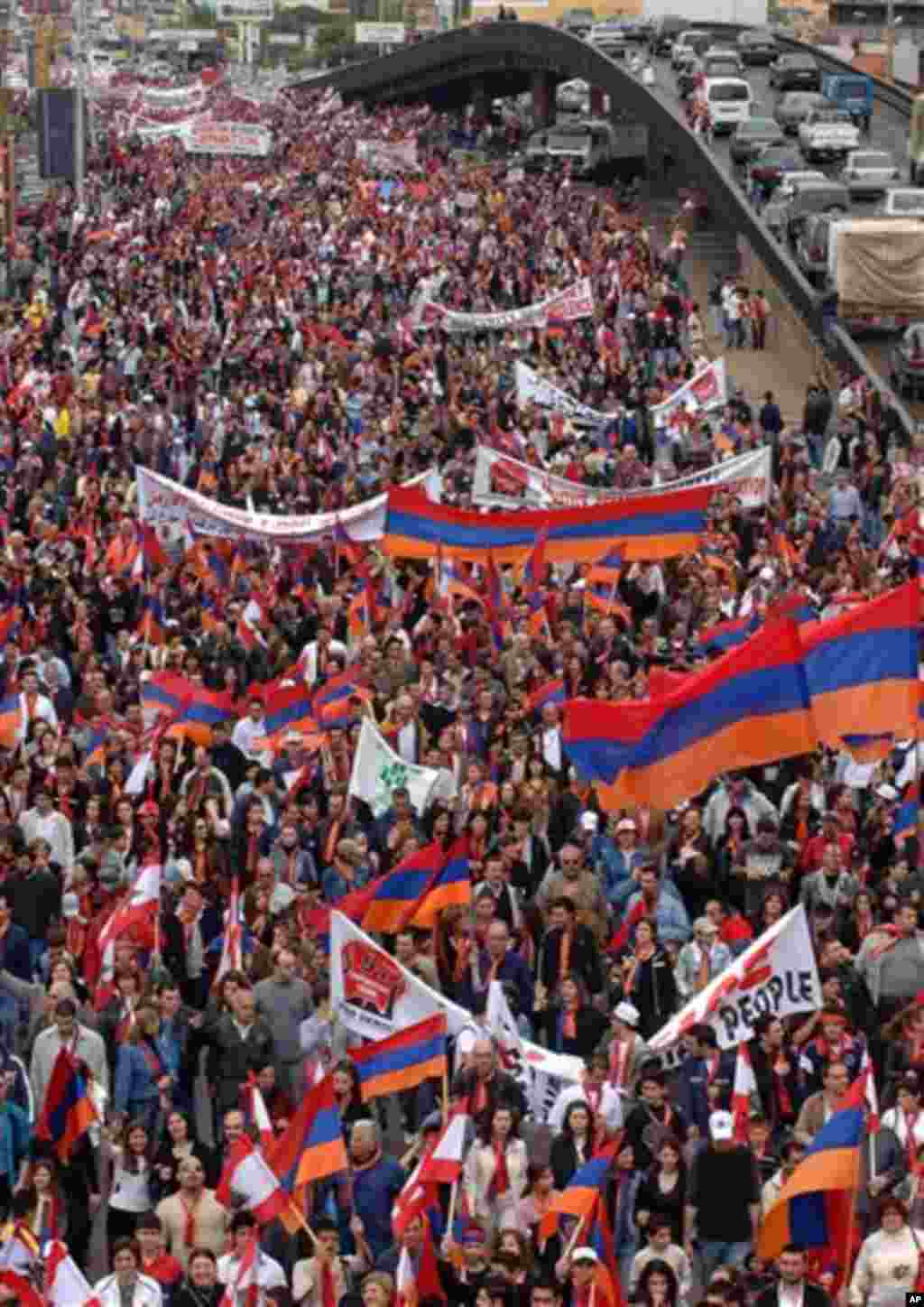 Lebanese Armenians wave Armenian flags and banners as they march on the main coastal highway of Jal el Dib, on the northern entrance to Beirut, Lebanon, Monday, April 24, 2006, to mark the 91st anniversary of massacres in Turkey that began in April 1915 a