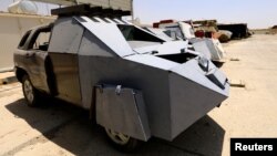 Vehicles used for suicide car bombings, made by Islamic State militants, are seen at Federal Police Headquarters after being confiscated in Mosul, Iraq, July 13, 2017.