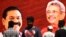 Supporters of Sri Lanka Podujana Peramuna (SLPP) party presidential candidate Gotabaya Rajapaksa walk past cut-out placards of the Rajapaksa brothers, Gotabaya (R) and Mahinda (L), in Colombo on November 17, 2019.