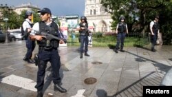 French police stand at the scene of a shooting incident near the Notre Dame Cathedral in Paris, France, June 6, 2017.