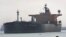FILE - An oil tanker passes through the Suez Canal in Ismailia, Egypt.