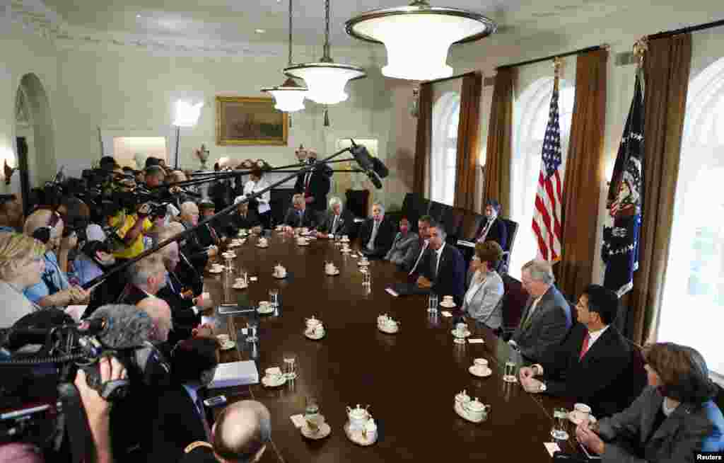U.S. President Barack Obama (5th R) discusses a military response to Syria at a meeting with bipartisan Congressional leaders in the Cabinet Room at the White House in Washington, D.C.