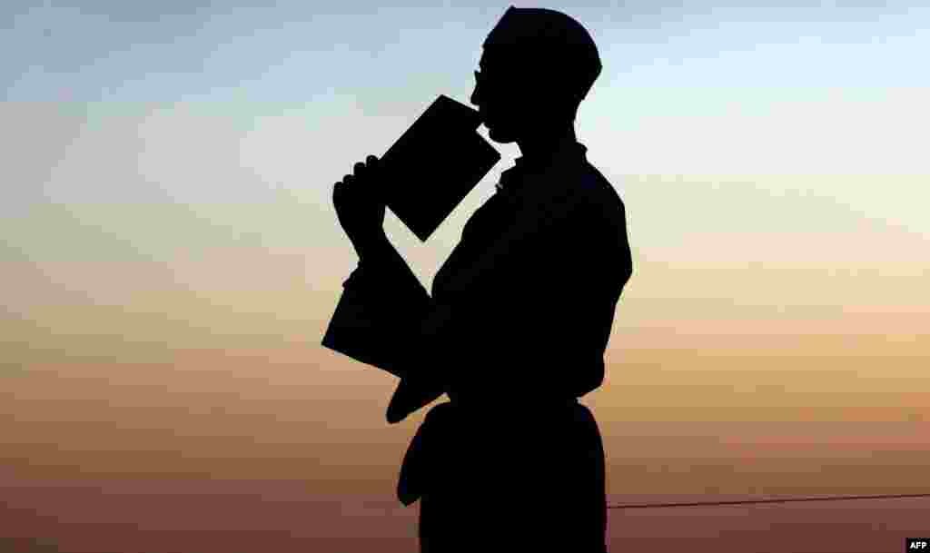 A Samaritan prays during the holiday of Sukkot (the Tabernacles Feast) celebrations on Mount Gerizim, near the northern West Bank city of Nablus. Sukkot marks the exodus of the ancient Hebrew people from Egypt.