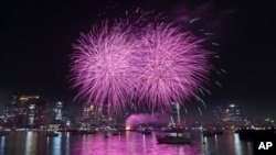 FILE - Fireworks explode over the harbor during Boston Harborfest's Fourth of July weekend celebrations, Saturday, July 1, 2023, in Boston.