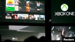 Yusuf Mehdi, senior vice president of Microsoft's Interactive Entertainment Business, discusses the Xbox One uses for television viewing during a press event in Redmond, Washington, May 21, 2013. 