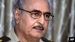 FILE - Libyan ex-General Khalifa Haftar addresses a press conference in Benghazi, Libya, May 17, 2014. 