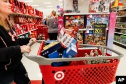 Shoppers browse the aisles during a Black Friday sale at a Target store, Nov. 23, 2018, in Newport, Ky.