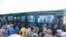Buses carrying rebels and their families are seen in Deraa, the city that was the birthplace of peaceful protests against autocratic Assad family rule that broke out a decade ago.