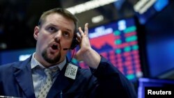 A trader works on the floor of the New York Stock Exchange, March 22, 2018.