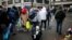 Migrants as they transfer to reception centers across the country during the dismantlement of makeshift camps, Stalingrad metro station, Paris, France, Nov. 4, 2016.