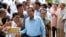 Cambodian Prime Minister Hun Sen, center, of ruling Cambodian People's Party pose for a selfie with his party supporters after a voting in the Senate election at Takhmau polling station in Kandal province, southeast of Phnom Penh, Cambodia, Sunday, Feb. 25, 2018. Cambodia's ruling party is assured of a sweeping victory in the election of a new Senate after the only real opposition to it was eliminated. (AP Photo/Heng Sinith)