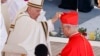 Newly elected Cardinal Robert Francis Prevost, Prefect of the Dicastery for Bishops, right, receives his biretta from Pope Francis as he is elevated in St. Peter's Square at the Vatican on Sept. 30, 2023.