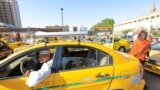 Former head of the Taxi Syndicate, Abdel Moneim Awad, waits for clients at the General Khartoum Taxi Station in Khartoum