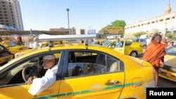 Former head of the Taxi Syndicate, Abdel Moneim Awad, waits for clients at the General Khartoum Taxi Station in Khartoum