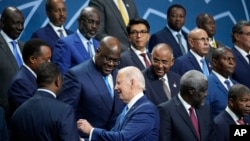 FILE - U.S. President Joe Biden talks with African leaders before they pose for a photo during the U.S.-Africa Leaders Summit at the Walter E. Washington Convention Center in Washington on Dec. 15, 2022.