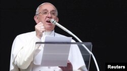 FILE - Pope Francis delivers his Sunday Angelus prayer in Saint Peter's Square, the Vatican, Feb. 1 2015.