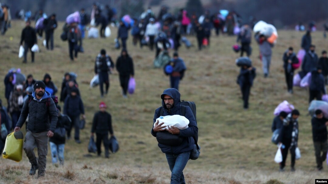 Migrants walk towards the forest after camp "Lipa" was closed, in Bihac, Bosnia and Herzegovina December 30, 2020. REUTERS/Dado Ruvic