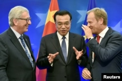 FILE - European Commission President Jean-Claude Juncker, left,Chinese Premier Li Keqiang, center, and European Council President Donald Tusk attend a signing ceremony during a EU-China summit in Brussels, June 29, 2015. The three will meet Friday to discuss their commitments to the Paris Agreement on fighting global warming.