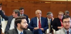 U.S. Special Representative for Afghanistan Reconciliation Zalmay Khalilzad, center, attends the opening of the intra-Afghan dialogue before leaving Afghans to talk among themselves, in Doha, Qatar, July 7, 2019.