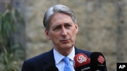 FILE - Philip Hammond, then the British foreign secretary, speaks at a press conference at the British embassy in Baghdad, Iraq, March 16, 2016.
