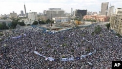 Thousands of Egyptians protest in Cairo's central Tahrir Square, the focal point of Egyptian uprising, as they hold banners and signs demanding prosecution of ousted president Hosni Mubarak and his regime Friday, April 8, 2011