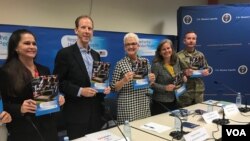US Mission officials in Uganda led by Ambassador Deborah Malac (C) launch the second report on US Aid to Uganda, Aug. 2, 2018. (H. Alhumani for VOA)