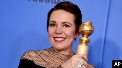 FILE - Olivia Colman poses in the press room with the award for best performance by an actress in a motion picture, musical or comedy for "The Favourite" at the 76th annual Golden Globe Awards at the Beverly Hilton Hotel in Beverly Hills, Calif., Jan. 6, 2019.