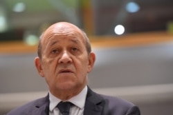 French Foreign Affairs Minister Jean-Yves Le Drian looks on during a Foreign Affairs meeting at the EU headquarters in Brussels, July 15, 2019.