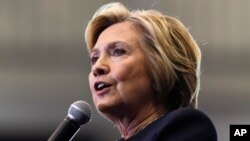 FILE - Democratic presidential candidate Hillary Clinton speaks during a rally at Cohoes High School in Cohoes, New York, April 4, 2016.