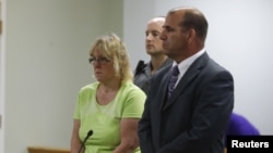 FILE - Joyce Mitchell, accused of smuggling contraband into the prison from which two convicts escaped last week, is arraigned in City Court in Plattsburgh, New York, June 12, 2015. 